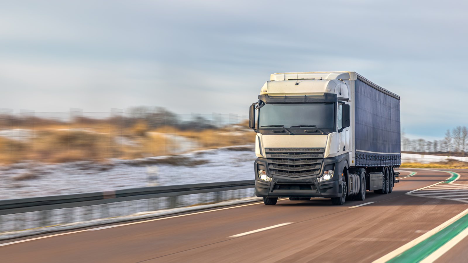 Row of modern closed-body container trucks