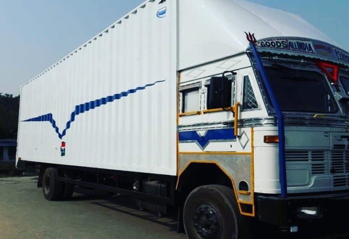 Single axle closed-body container trailer at dusk